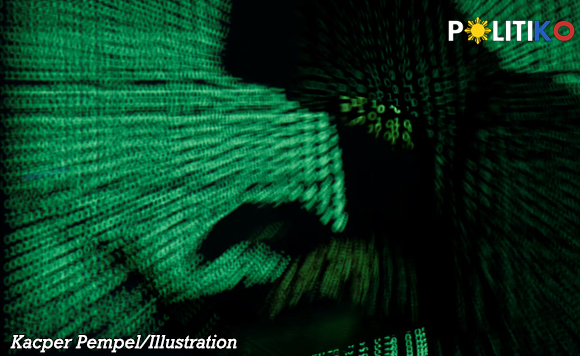 Green digital code streams form a hand-like shape on a keyboard, illustrating cybersecurity concepts.